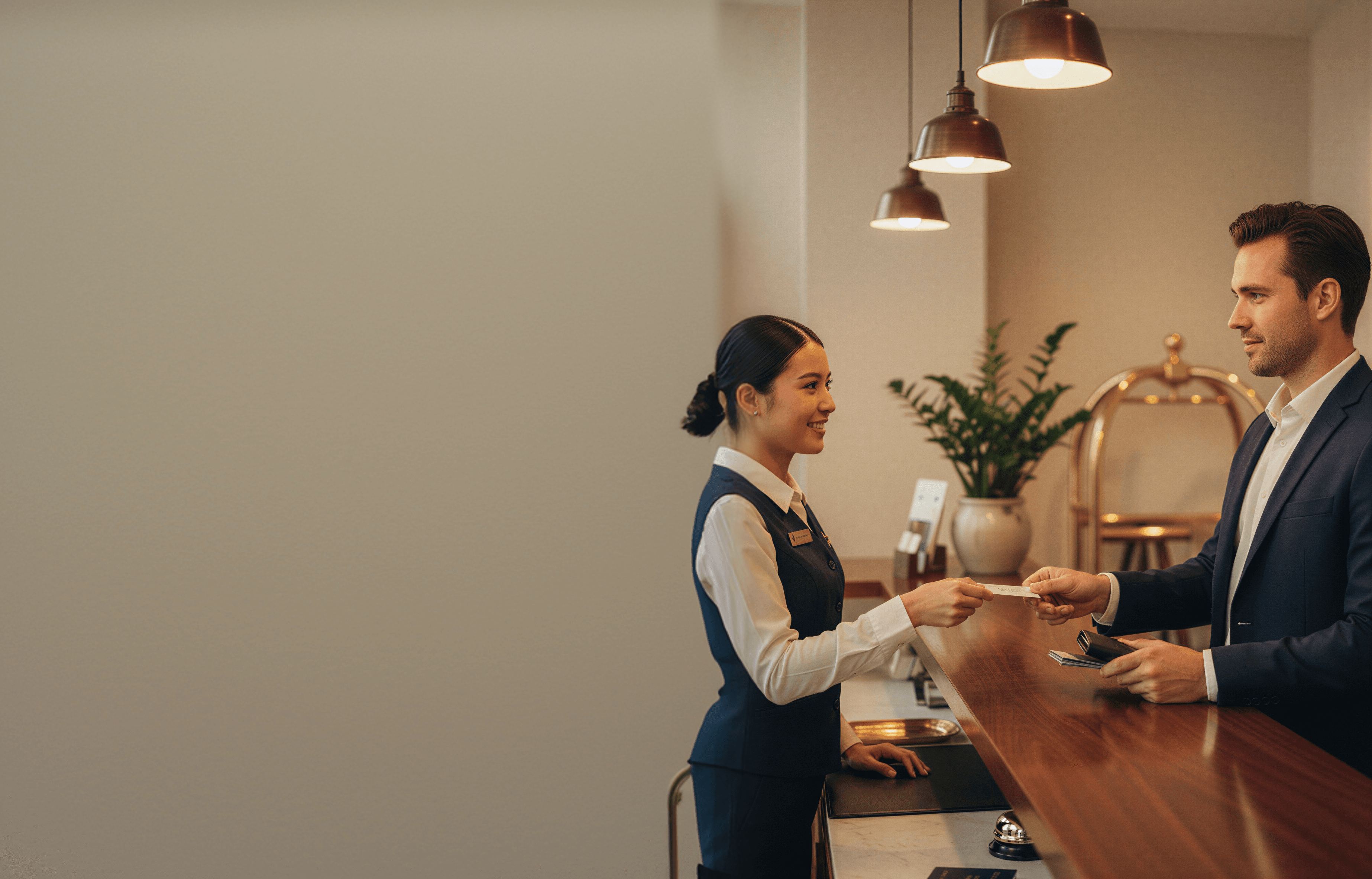 Travellers checking in at a hotel desk